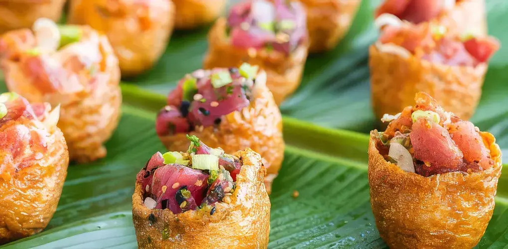 Umekes poke bombs on a banana leaf
