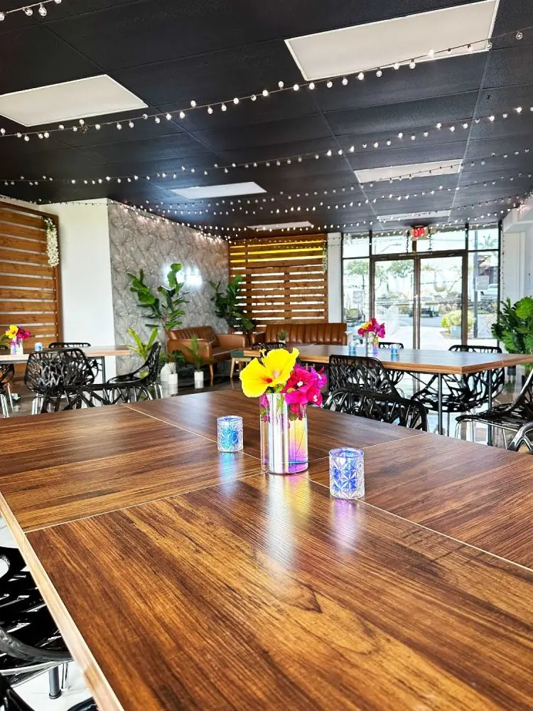 A long wooden table set for a party in the Umekes event space