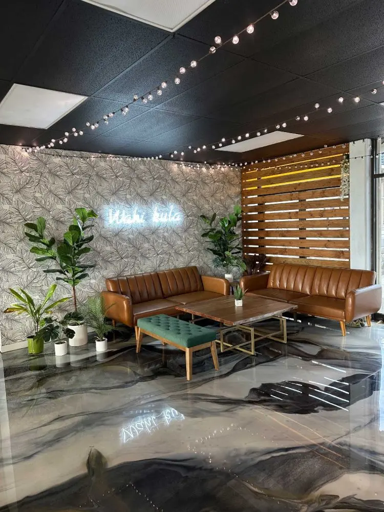 The Umekes event space lounge with marble floors and leather sofas