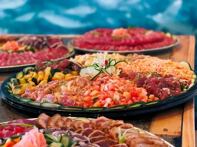 Makai Platter of poke, sashimi, garlic shrimp and ahi katsu at Umekes