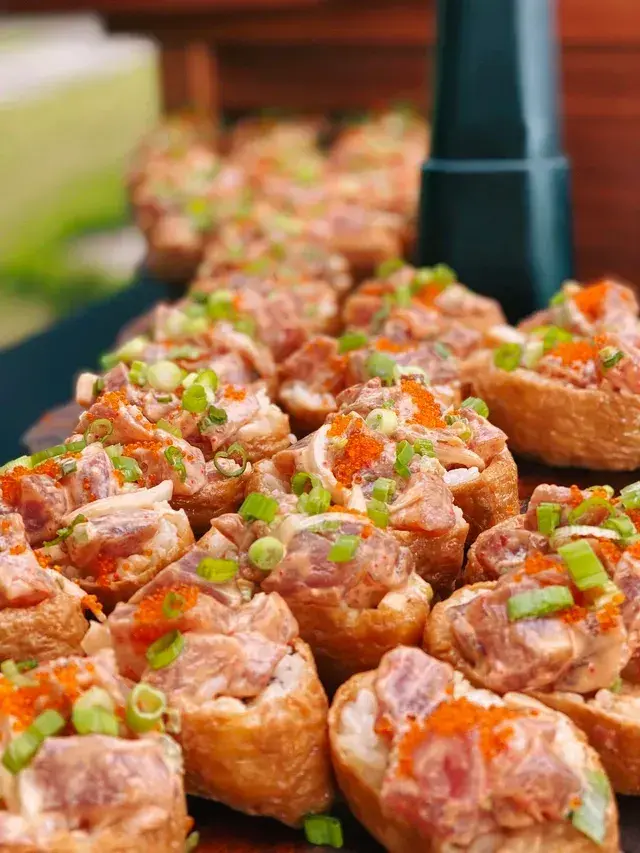 Poke bombs appetizer of tofu pouches and sushi rice