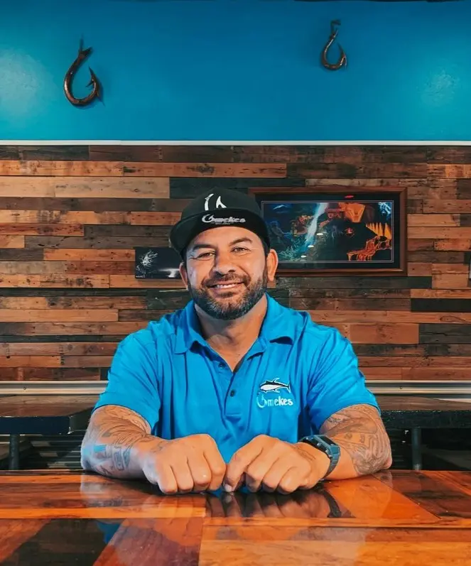Chef Nakoa Pabre at the bar inside Umekes Fish Market Bar & Grill