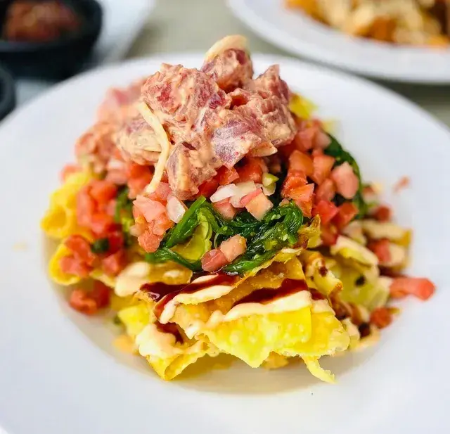Umekes Poke Nachos with wonton chips, seaweed salad and lomi salmon